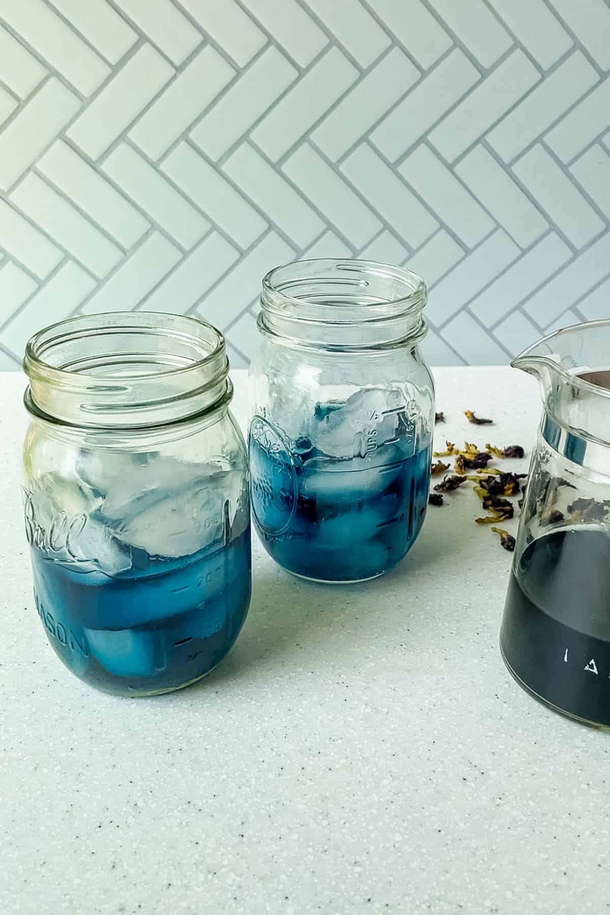 glasses half full with blue tea