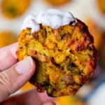 holding a baked leftover mashed potato pancake dipped in ranch dressing