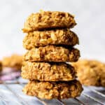 5 banana oatmeal cinnamon cookies stacked on cooling rack