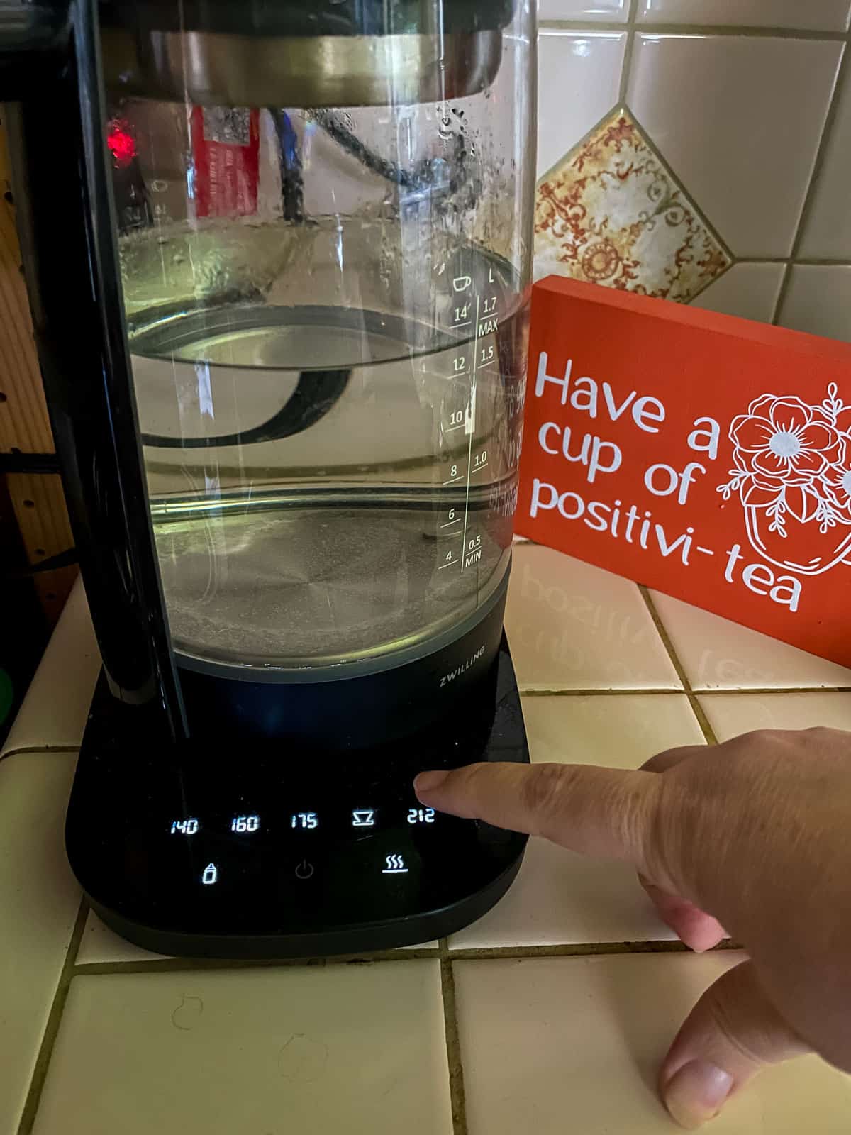 setting electric kettle to boil