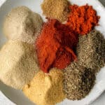 ingredients for Evelyn's Cajun Seasoning (salt-free, cayenne-free, black pepper-free): smoked sweet paprika, sweet paprika, cumin, thyme, oregano, garlic, onion and white pepper