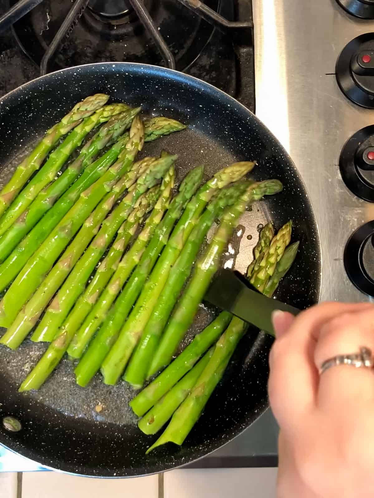 Step 4 - flip and steam saute asparagus until bright green and crisp tender