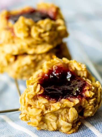jam-filled thumbprint oat cookies on cooling rack