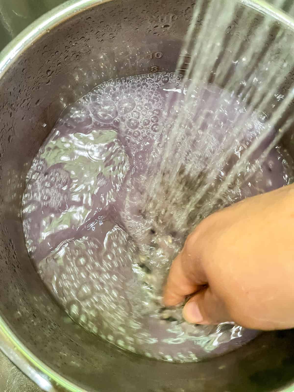 Process step 2 rinsing rice and water turning purple