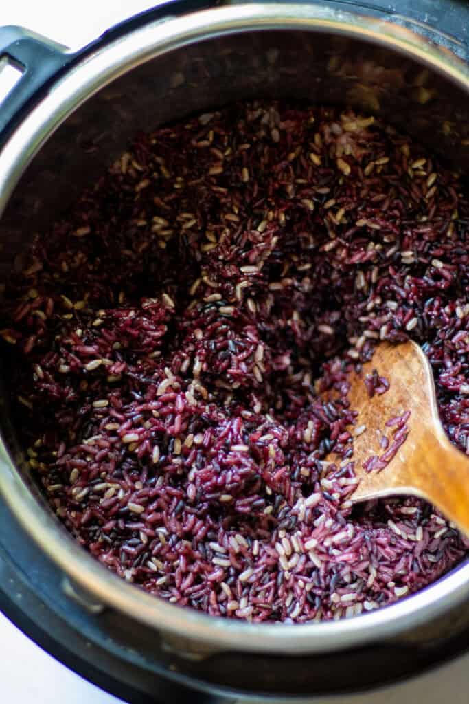 Instant pot full of cooked purple rice