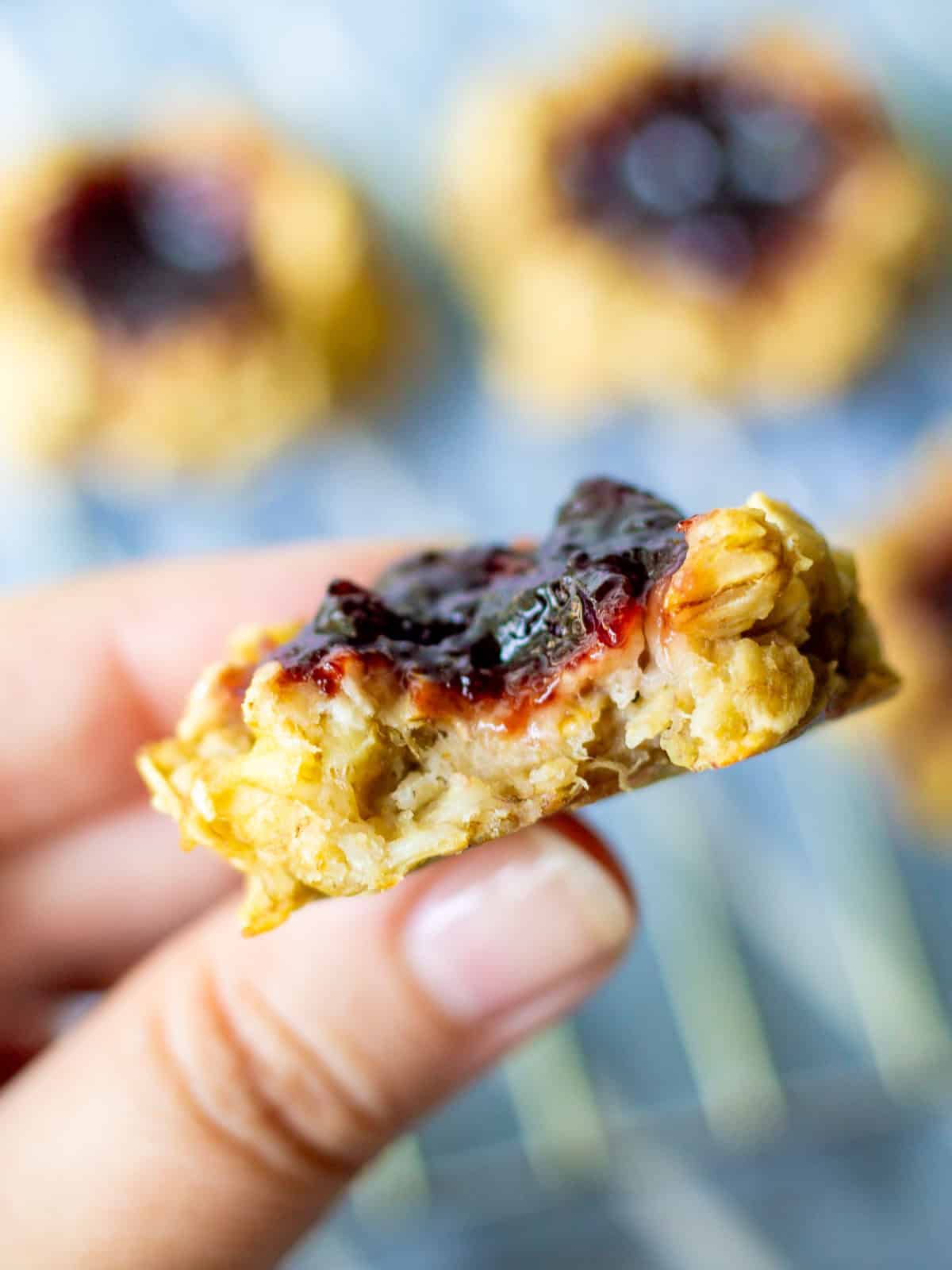 inside texture of chewy banana oat thumbprint cookie with fruit jam