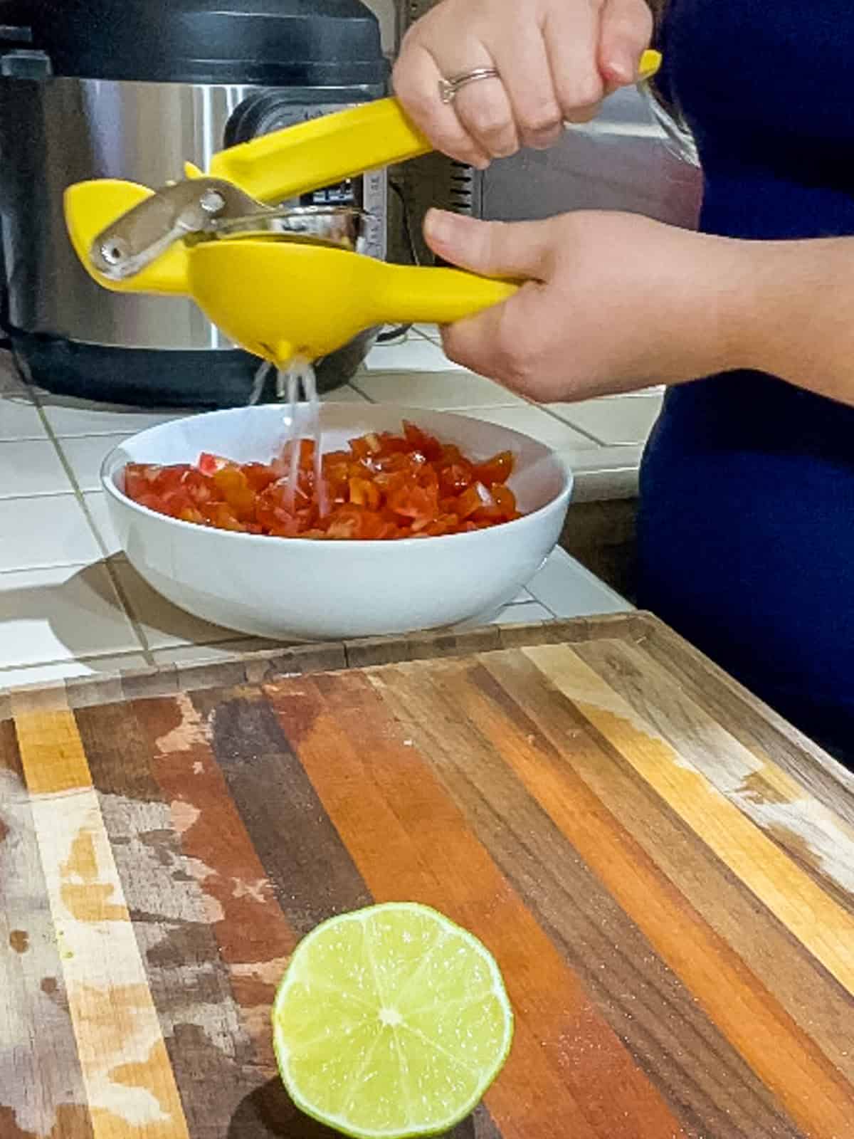 Squeezing lime juice into bowl