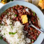 bowl of vegan red beans and rice with cornbread