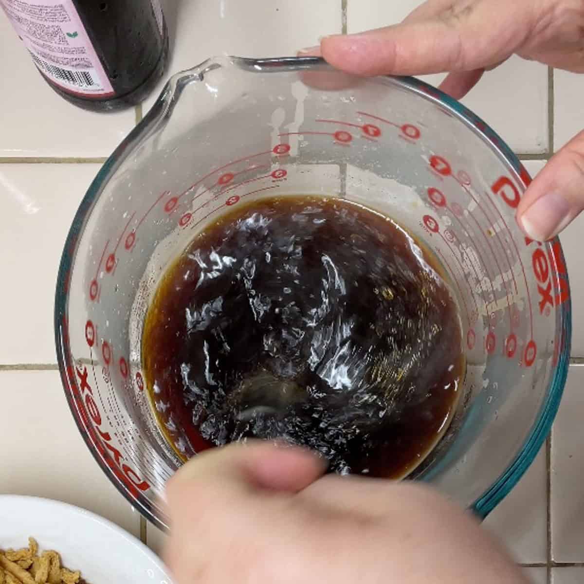 Process step 1 - mixing soy curl marinade ingredients in bowl