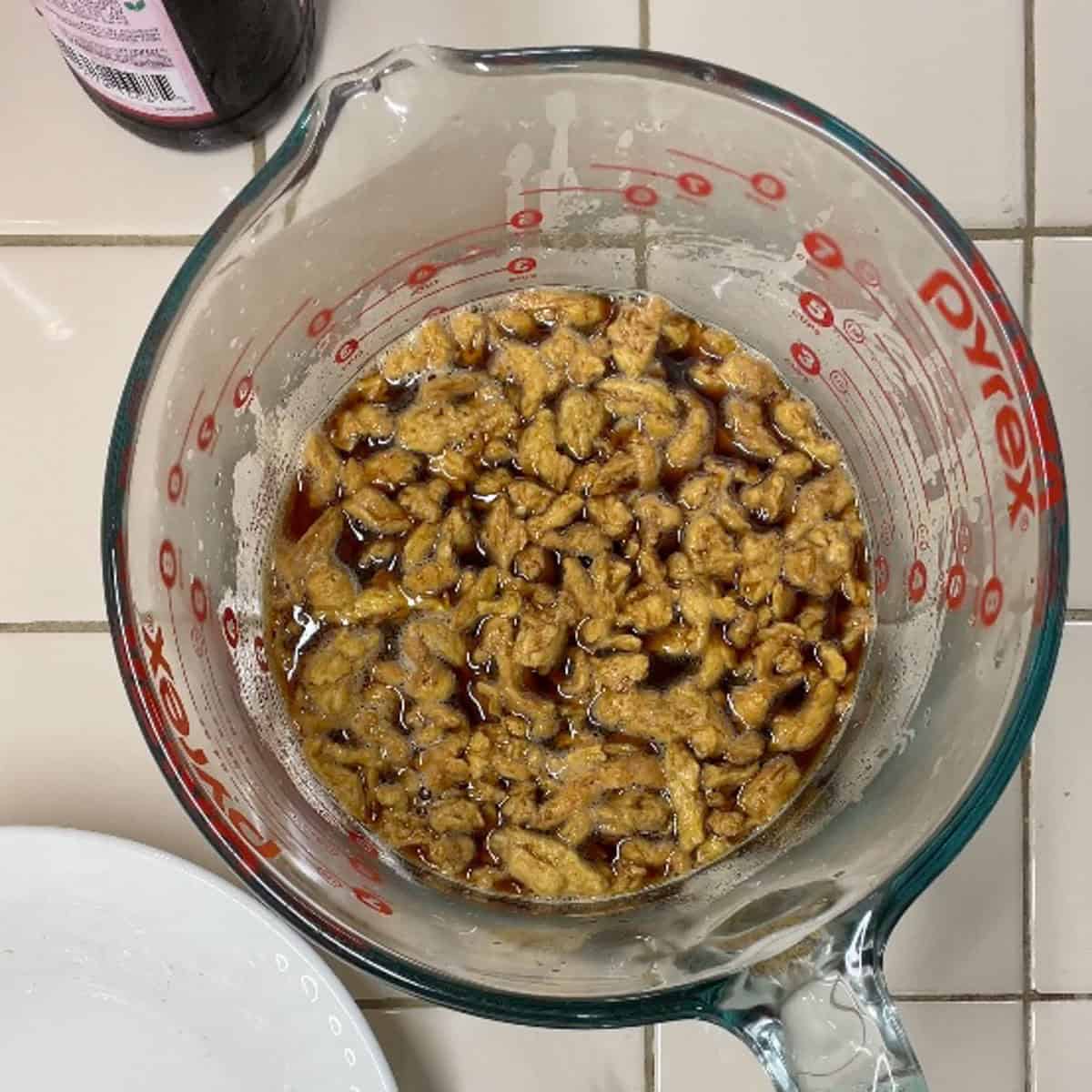 Process step 2 - add soy curls to marinade and set aside