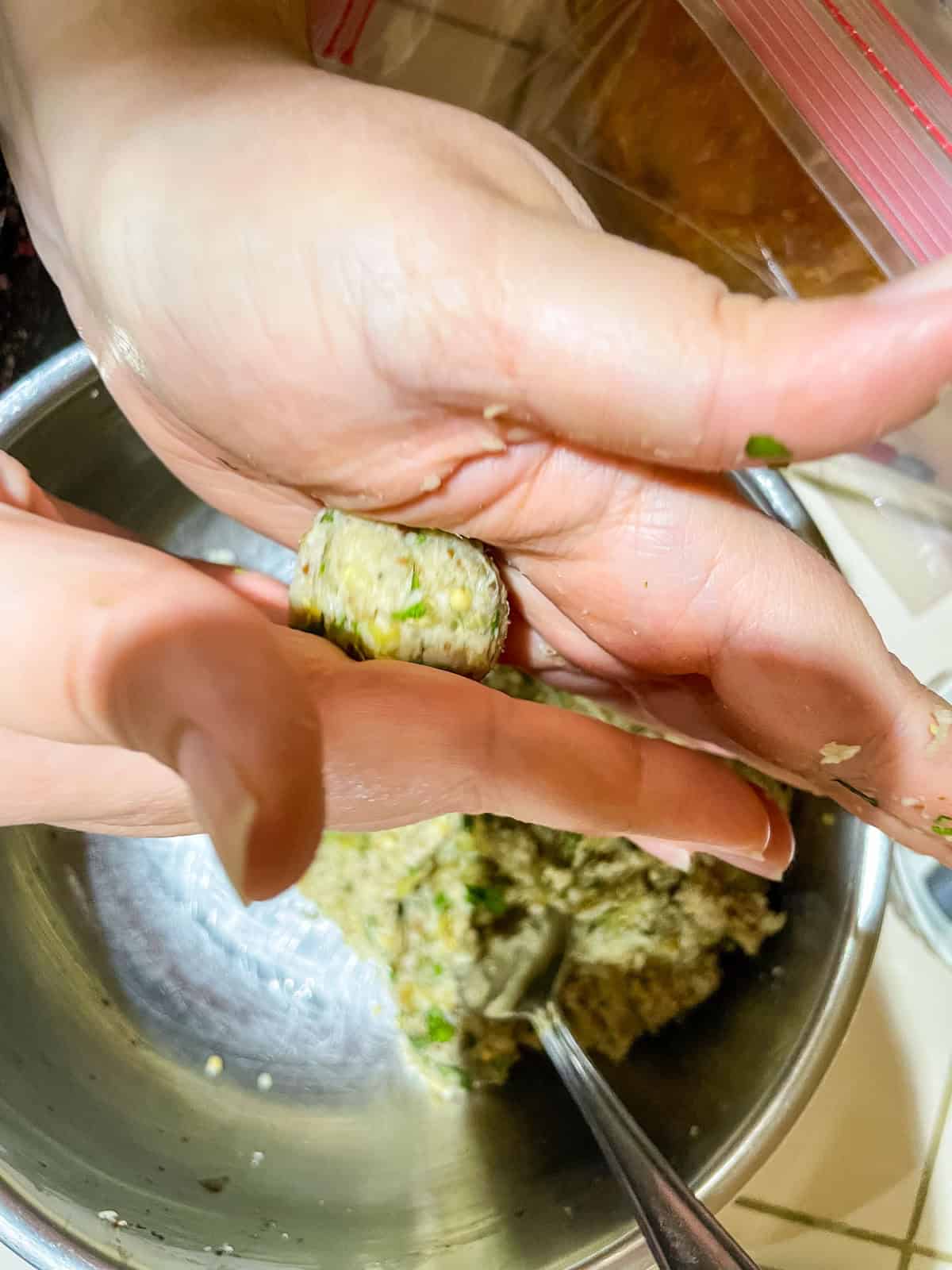 Process step 8 - form small eggplant meatballs by rolling dough using your hands