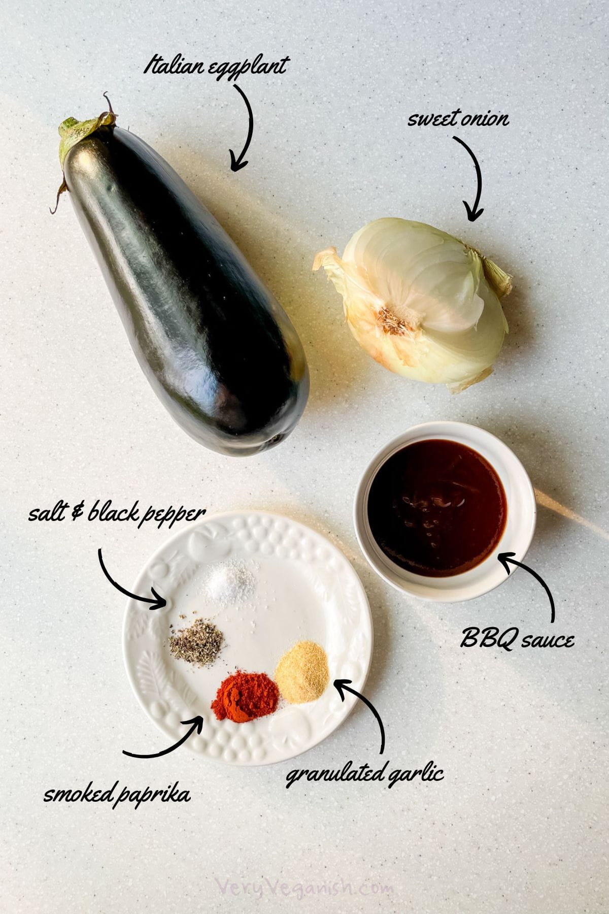 Ingredients for roasted BBQ eggplant and onion: italian eggplant, sweet onion, bbq sauce, salt, black pepper, smoked paprika, granulated garlic