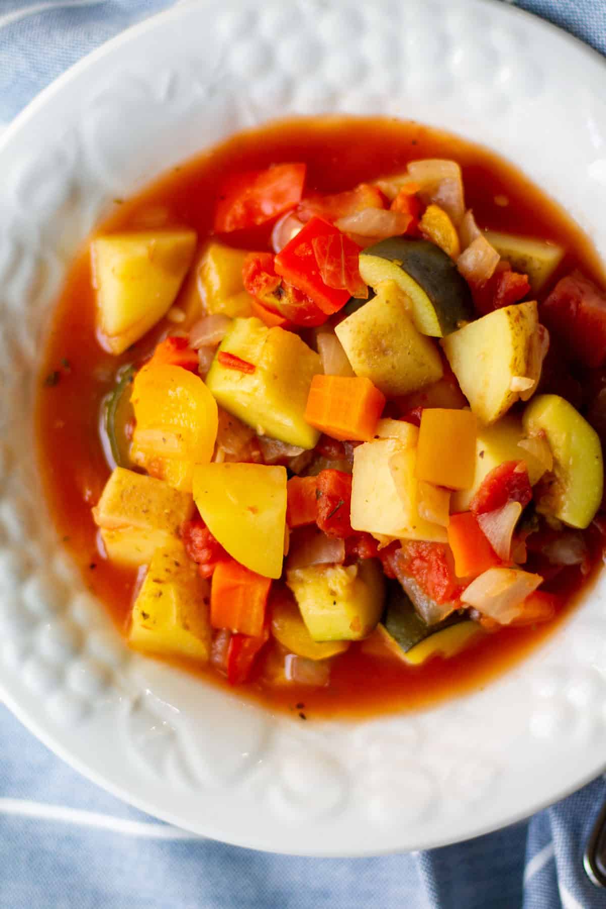 white bowl full of vegetable potato stew