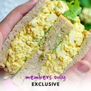 Holding a tofu egg salad sandwich
