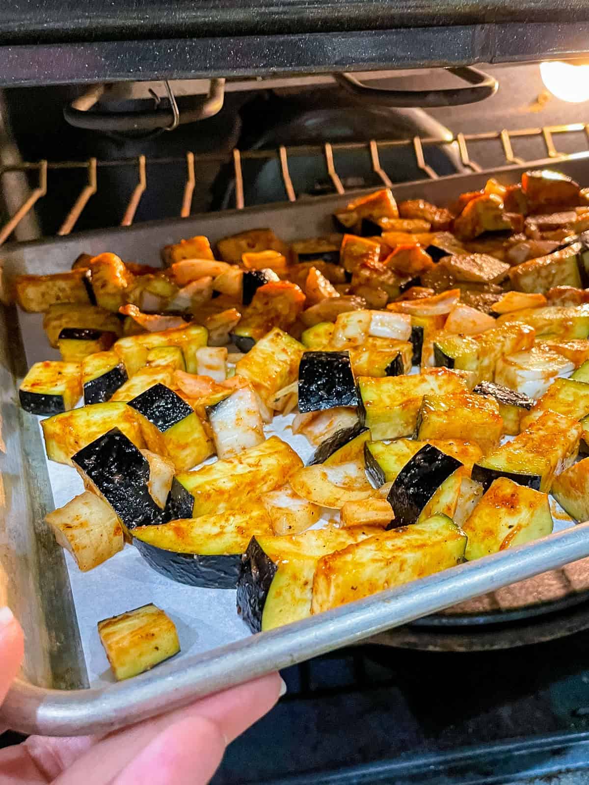placing sheet pan in hot oven