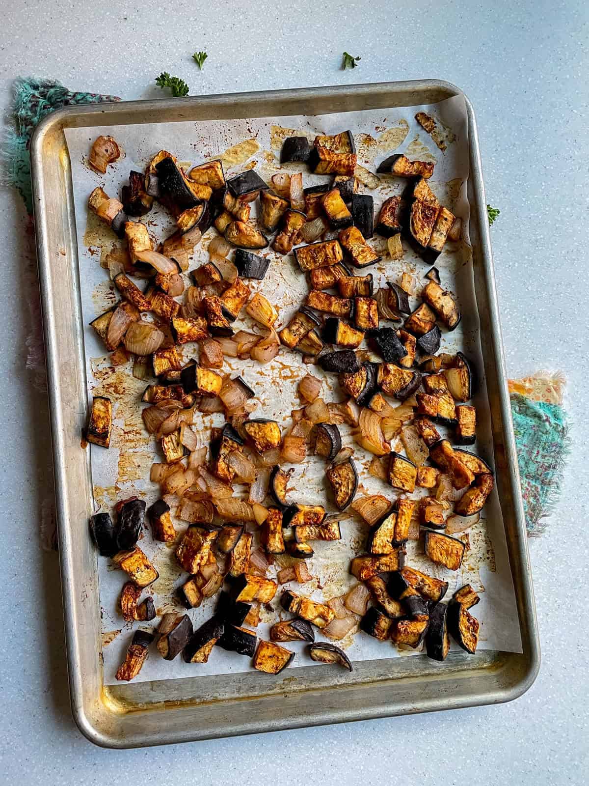 after shot of roasted eggplant and onion on sheet pan