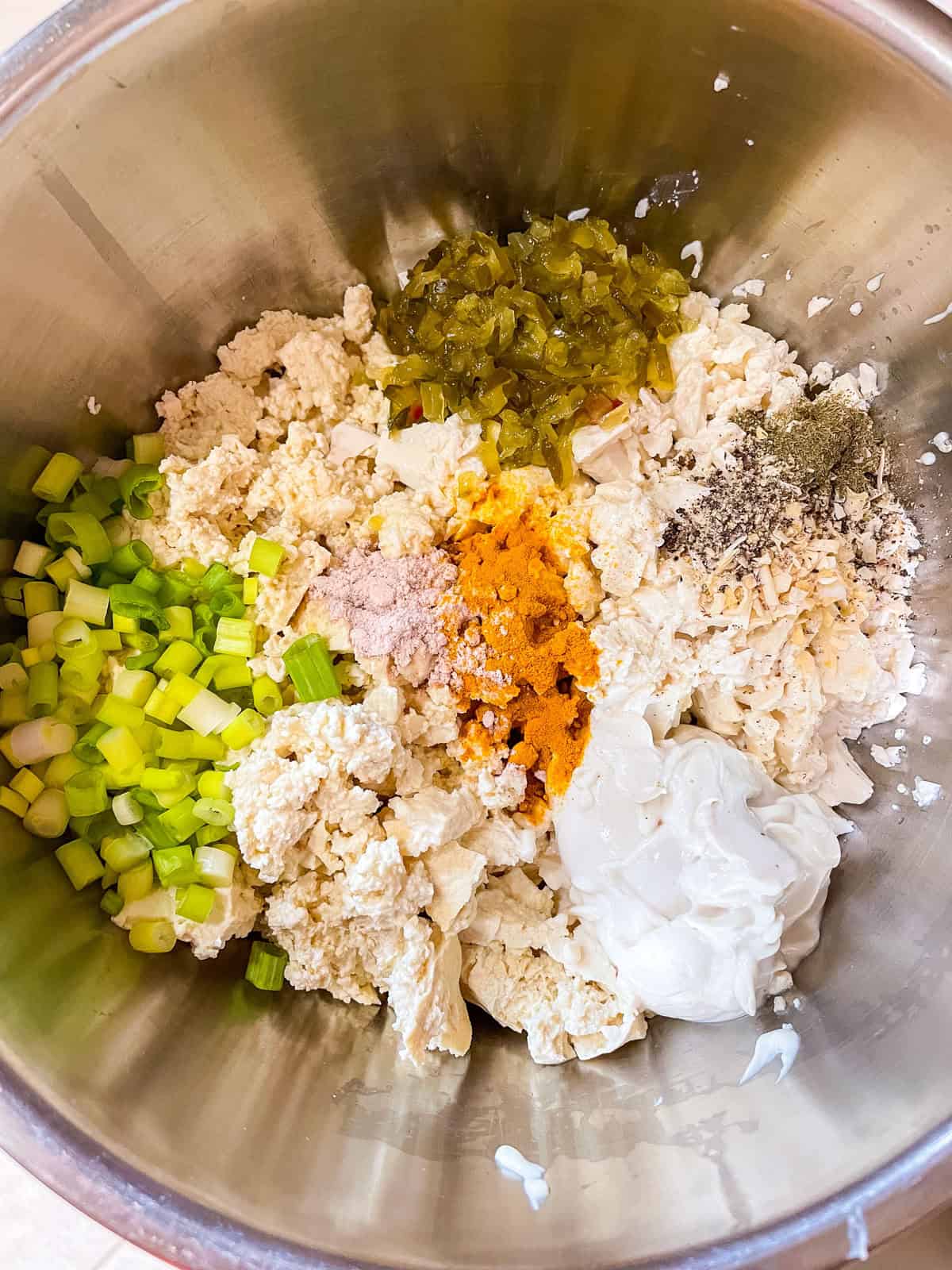 remaining ingredients for egg salad added to bowl