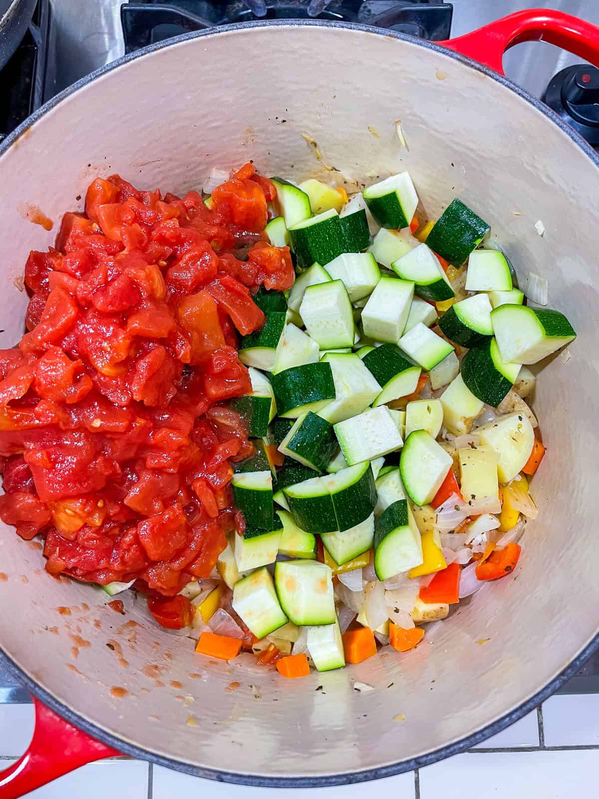 zucchini and tomatoes added to pot