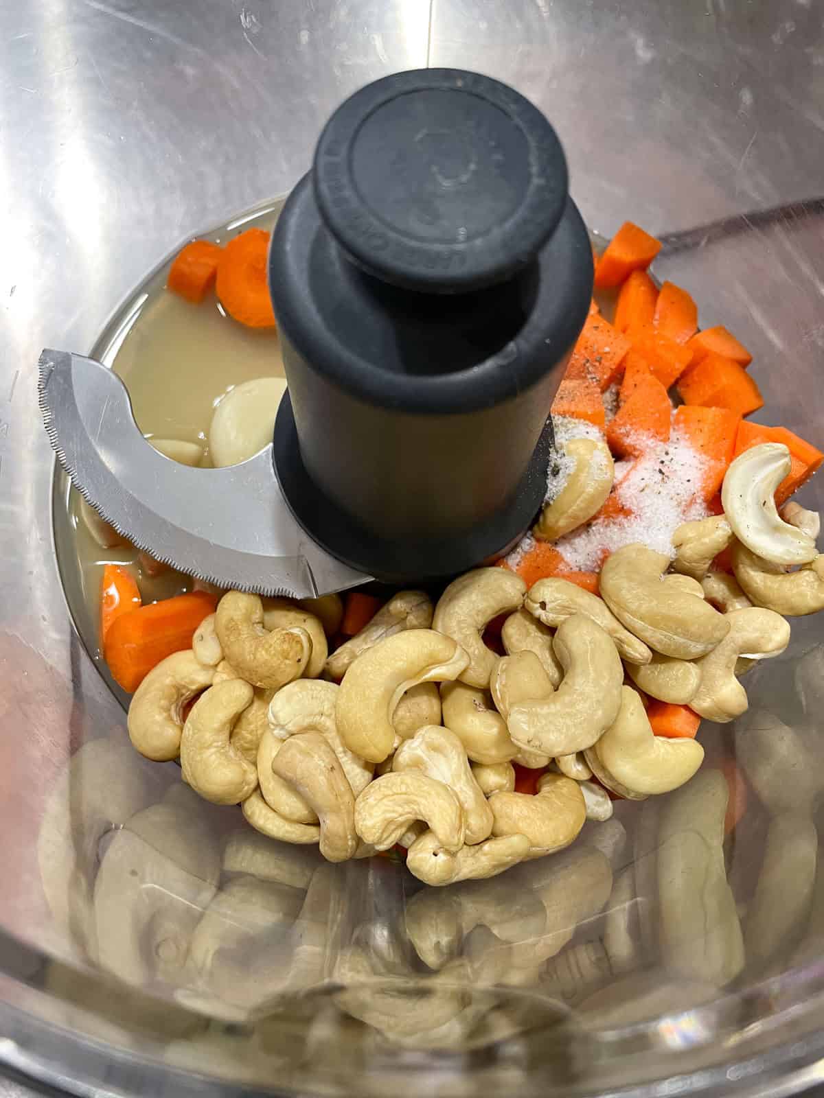 food processor with carrot and cashews added