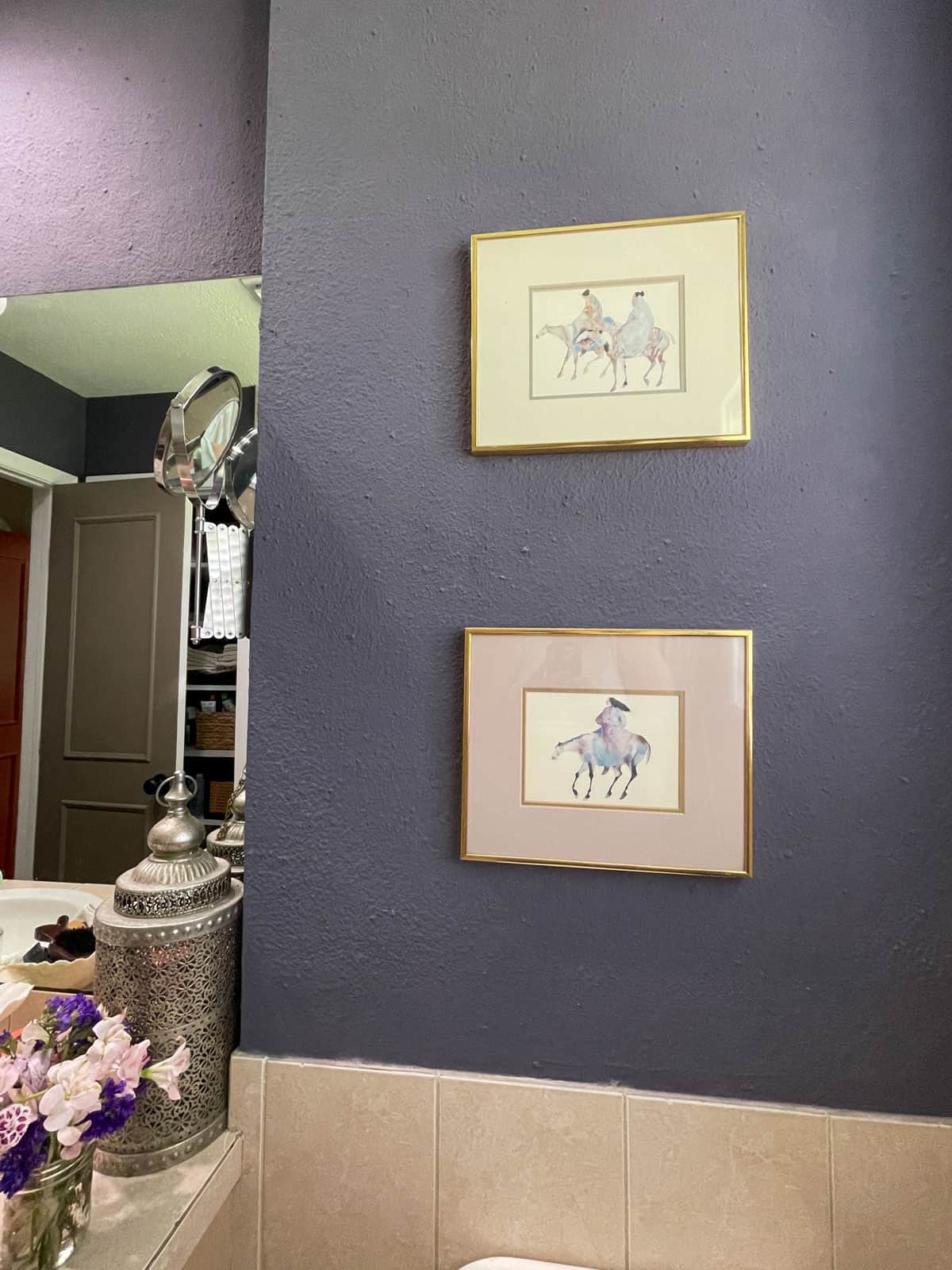Bathroom accent wall painted with James Alexander Natural Paint featuring textured walls, framed artwork, and neutral décor after one year of use.