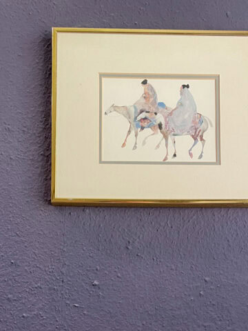 Gold-framed watercolor artwork displayed on a textured bathroom wall painted with James Alexander Natural Paint after one year of everyday use.